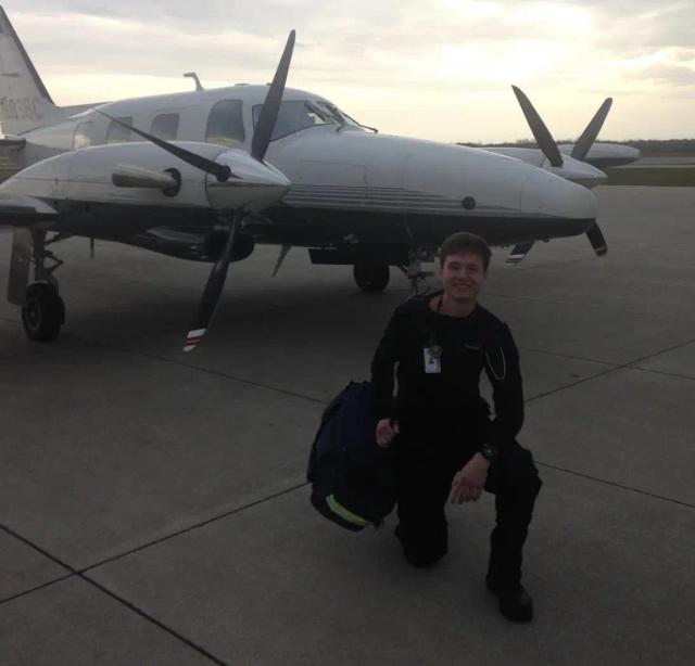 Myself posing in front of a private solo plane at Purdue University Airport